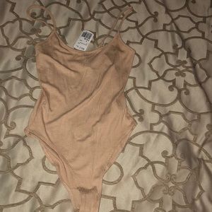 NWT Scoop-back body suit